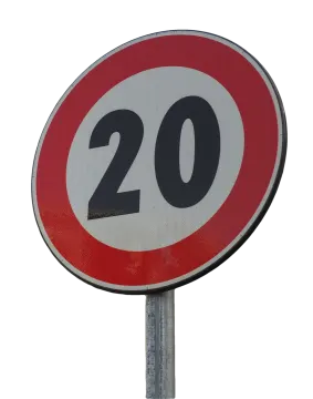 a red and white road sign with the number 20