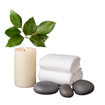 a candle and two towels next to each other items