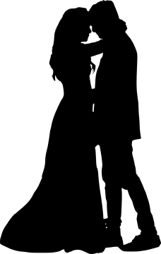 a silhouette of a bride and groom kissing