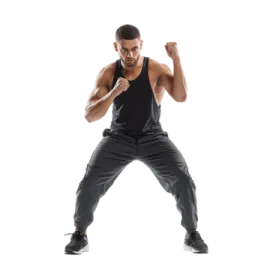 a man in a black tank top and grey pants