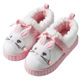 a pair of white and pink baby shoes with bunny ears