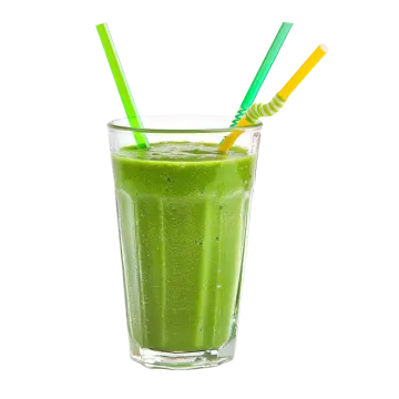 a glass of green smoothie with two straws