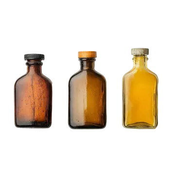 a group of three empty brown glass bottles