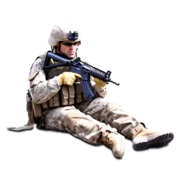a soldier sitting on the ground with his rifle
