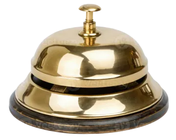 a brass bell on a white background