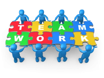 a group of people holding puzzles with the words teamwork
