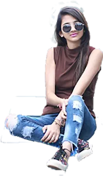 a woman sitting on the ground wearing sunglasses