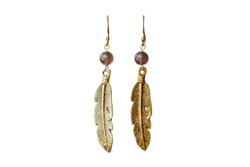 a pair of earrings with feathers and beads
