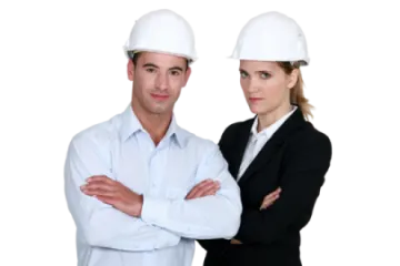 a man and woman wearing hard hats