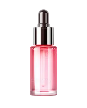 a bottle of pink liquid on a white background