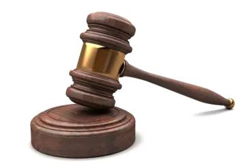 a wooden judge's gaven on a white background