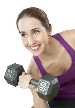 a woman is smiling while holding two dumbs