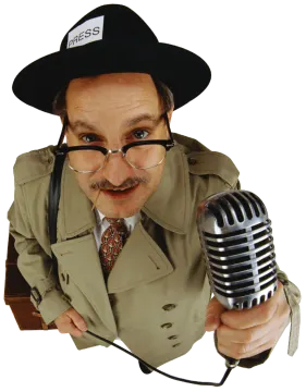 a man wearing a hat and holding a microphone