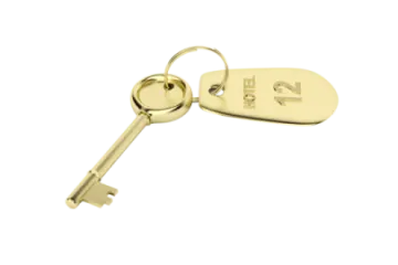 a gold key on a white background