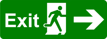 a green exit sign with an arrow pointing to the left