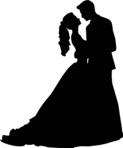 a silhouette of a bride and groom kissing