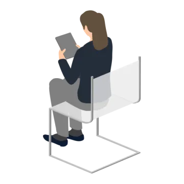 a person sitting on a chair reading a book