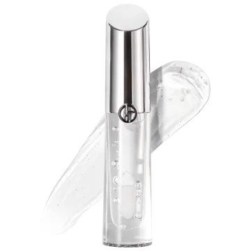 a bottle of white liquid with a silver cap on it
