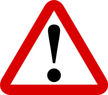 a red and white triangular sign with a black exor on it
