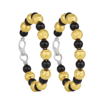 a pair of black and gold hoop earrings