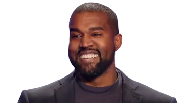 a man with a beard smiles at the camera
