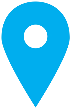 a blue pin with a white circle on it