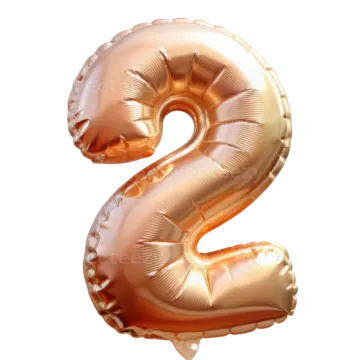 a gold foil balloon shaped like the number 2