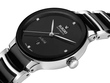 a black and silver watch on a white background