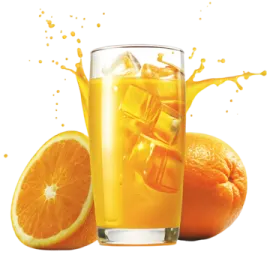 a glass of orange juice next to an orange slice