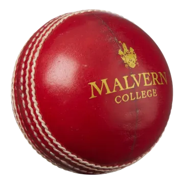 a red leather cricket ball on a white background