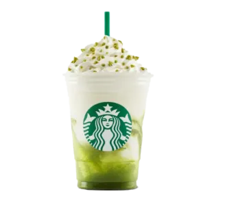 a starbucks cup with a green drink in it