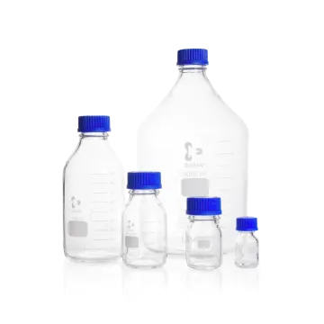 a set of three bottles with blue caps