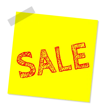 a post - it note with the word sale written on it