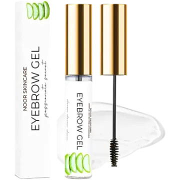 the eyelashe mascara is in front of a white box and gold lid