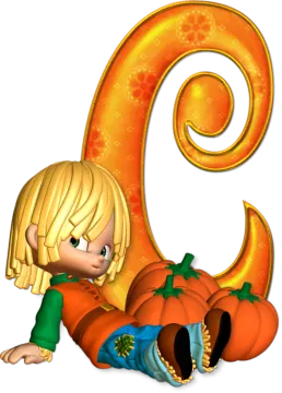 a little girl laying on the ground next to a pumpkin