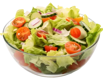a salad in a glass bowl on a white background