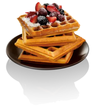 a plate with was and berries on top