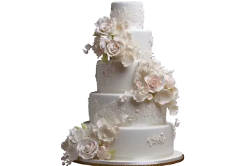 a white wedding cake with flowers on top