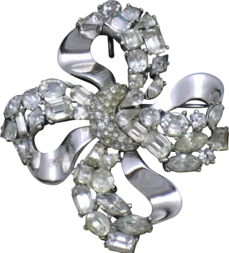 a silver and crystal flower broochle