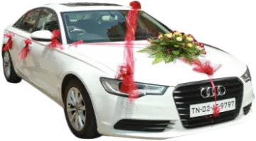 a white car with a bouquet on the hood