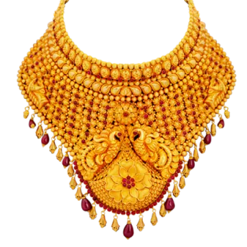 a gold necklace with red stones and pearls