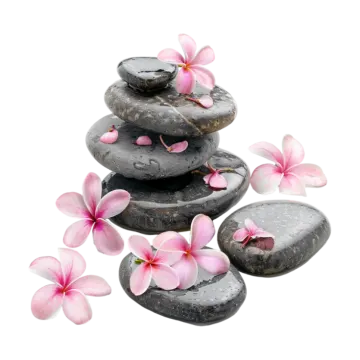 a pile of black stones with pink flowers on top