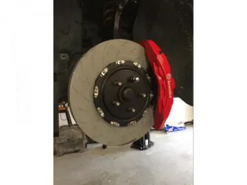 a red brake disc on a white background