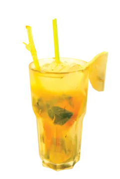 a glass filled with a drink and a lime slice