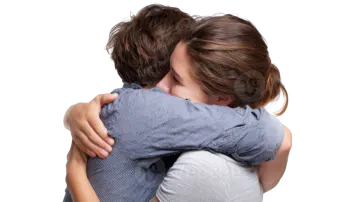 a young boy is hugging his mother