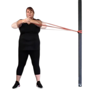 a woman in black shirt and black leggings holding a red resistance rope
