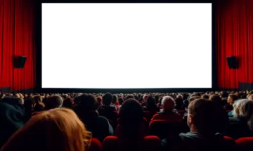 a large screen in the middle of a movie theater