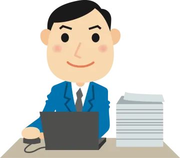 a man in a suit sitting at a desk with a laptop