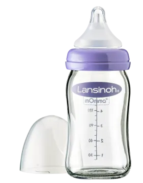 a baby bottle with the lid open