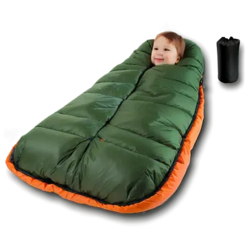 a small child laying on a sleeping bag